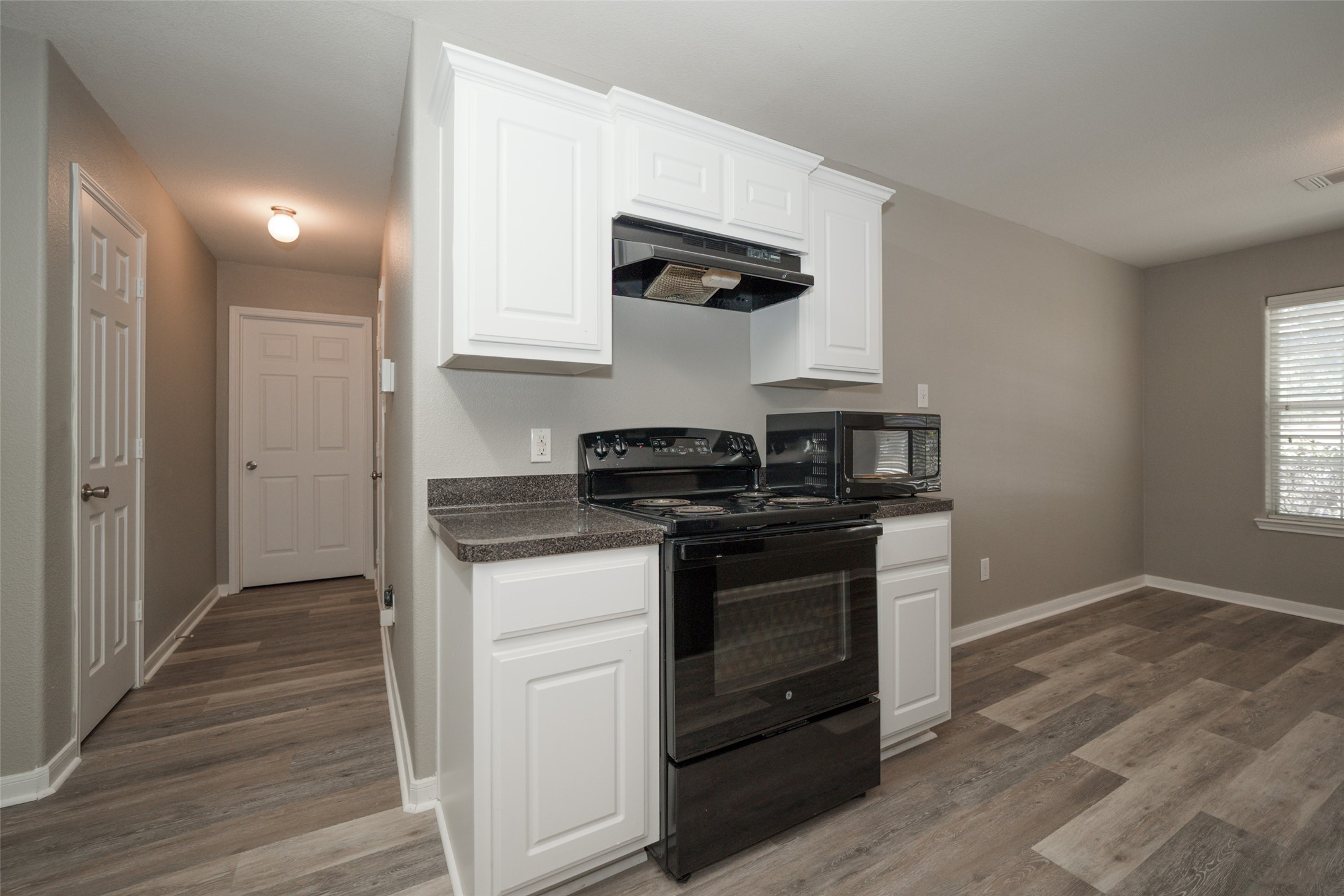 28894 Llano River Loop Spring, TX 77386 - Photo 8 of 33 a kitchen with stainless steel appliances granite countertop a stove and a refrigerator