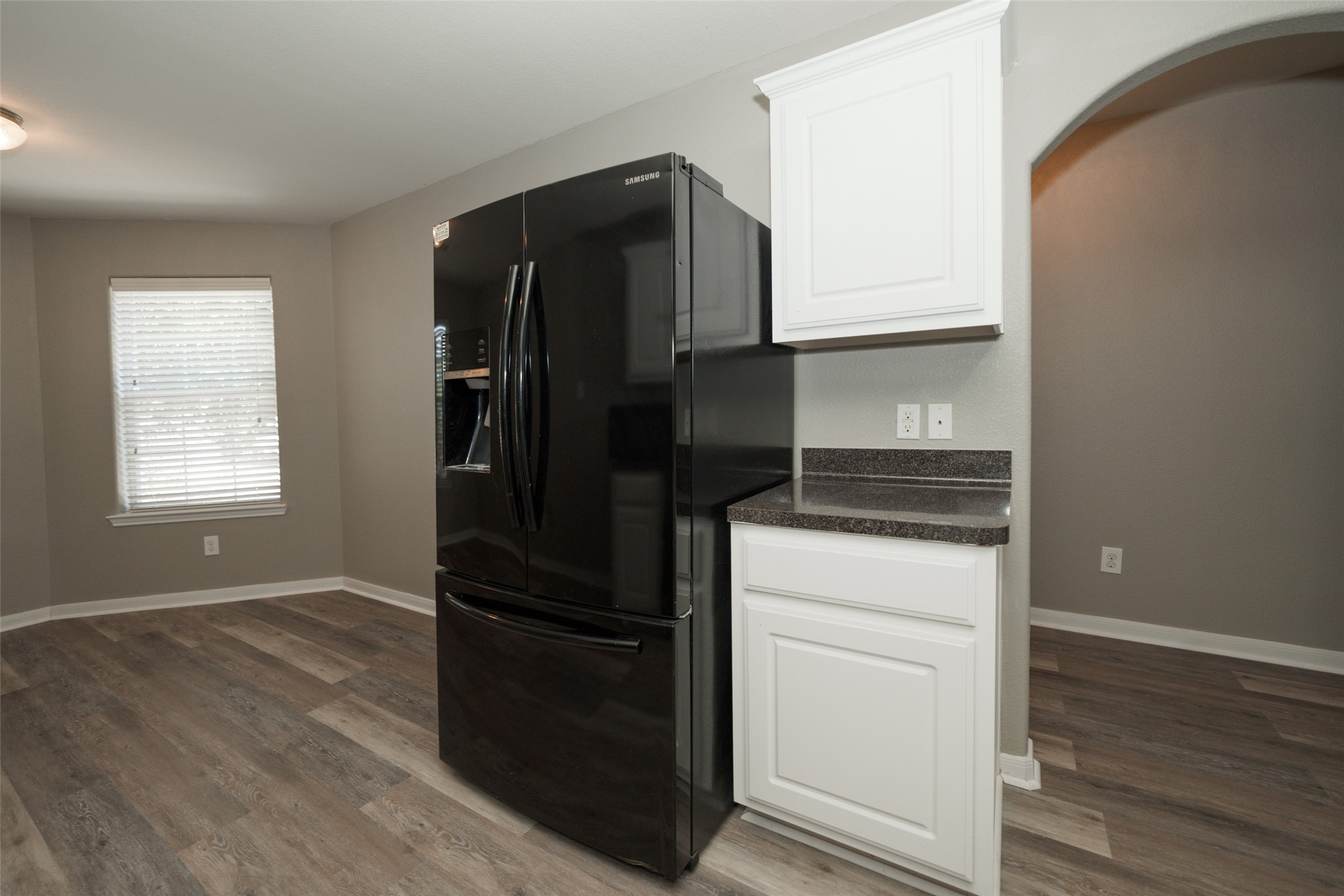 28894 Llano River Loop Spring, TX 77386 - Photo 9 of 33 a kitchen with a refrigerator and a stove top oven