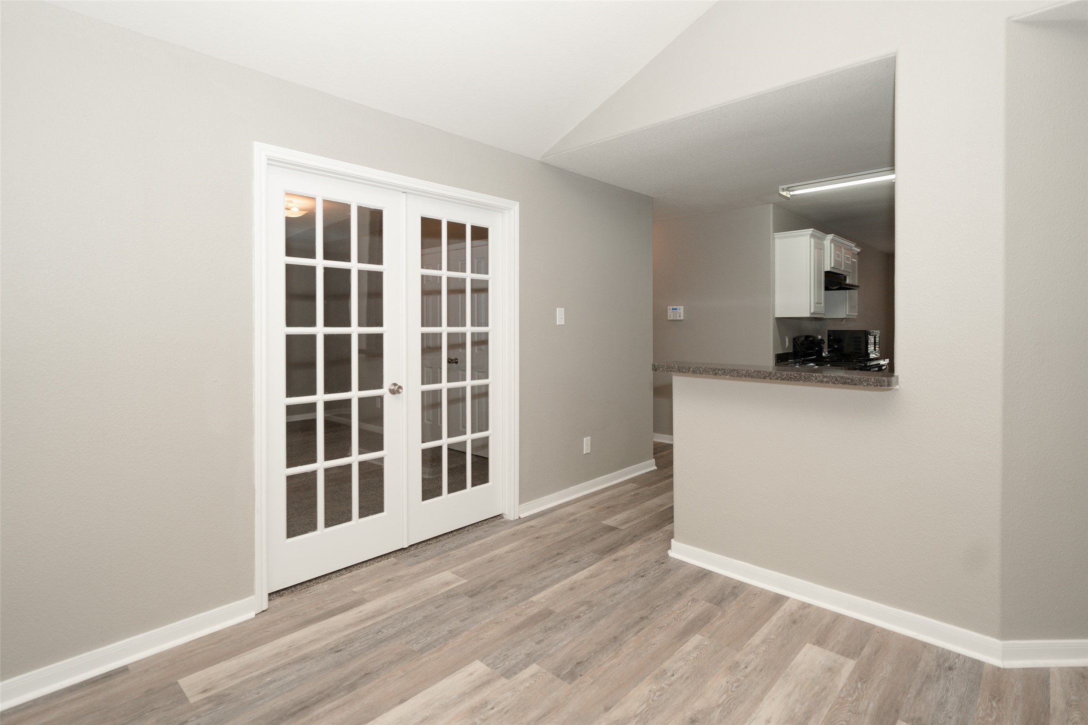 28894 Llano River Loop Spring, TX 77386 - Photo 10 of 33 a view of empty room with wooden floor and cabinet