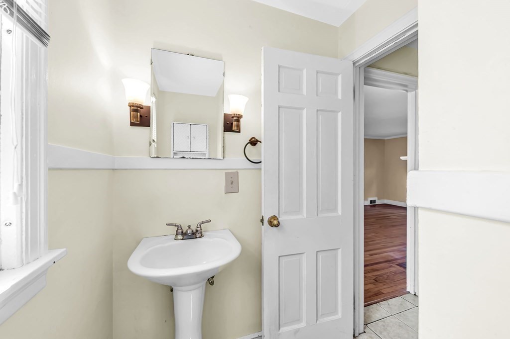 41 Cooley Drive Longmeadow, MA 01106 - Photo 12 of 30 a bathroom with a sink and a mirror