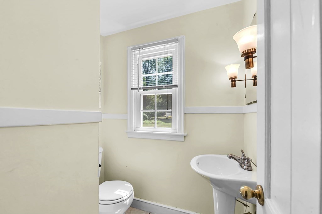 41 Cooley Drive Longmeadow, MA 01106 - Photo 13 of 30 a bathroom with a sink a toilet and a mirror