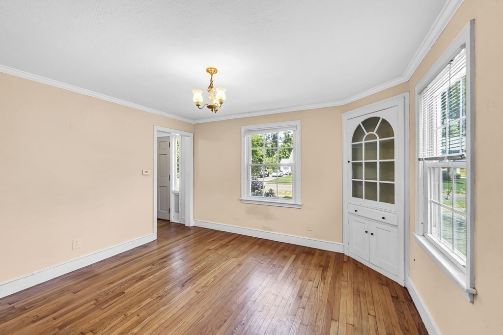 41 Cooley Drive Longmeadow, MA 01106 - Photo 15 of 30 a view of an empty room with a window and wooden floor