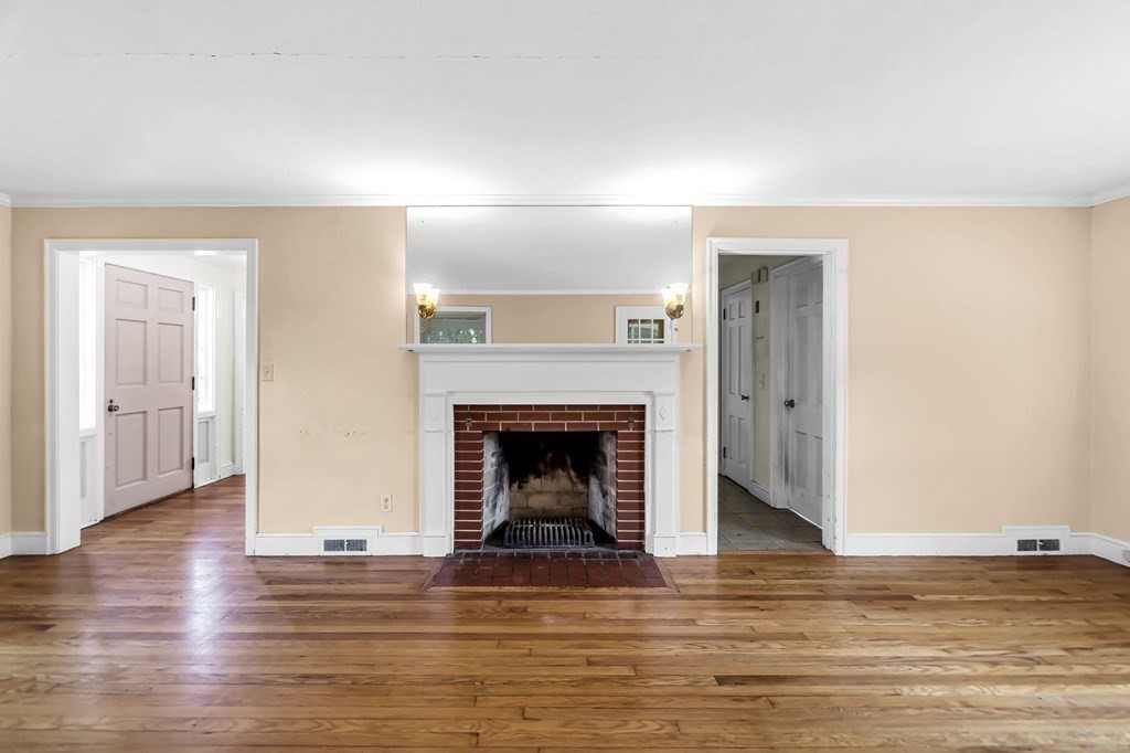 41 Cooley Drive Longmeadow, MA 01106 - Photo 18 of 30 a view of a livingroom with wooden floor and a fireplace