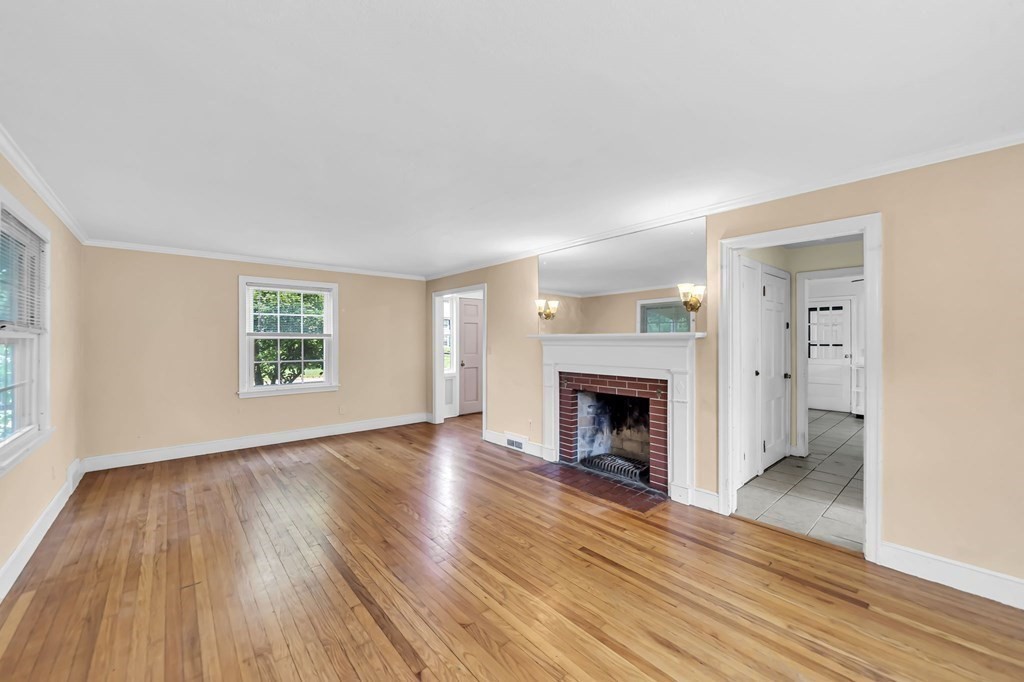 41 Cooley Drive Longmeadow, MA 01106 - Photo 19 of 30 an empty room with wooden floor fireplace and windows