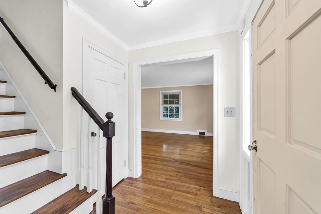 41 Cooley Drive Longmeadow, MA 01106 - Photo 21 of 30 a view of a hallway with wooden floor and staircase