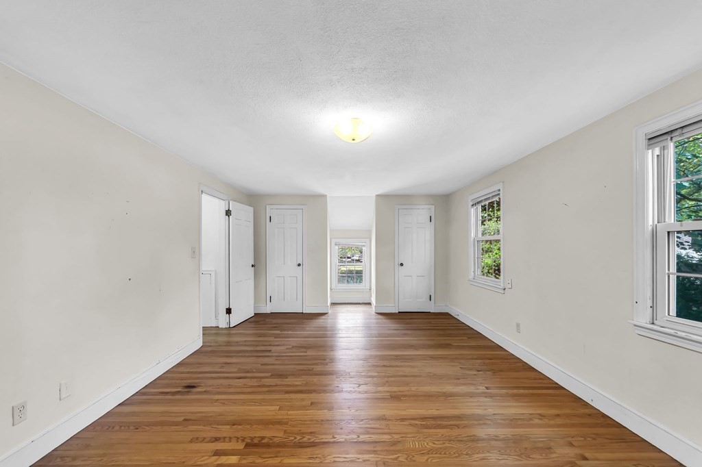 41 Cooley Drive Longmeadow, MA 01106 - Photo 23 of 30 a view of an empty room with window and wooden floor