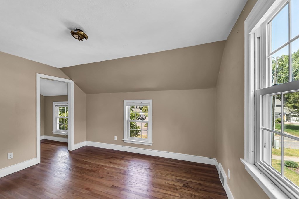 41 Cooley Drive Longmeadow, MA 01106 - Photo 24 of 30 an empty room with wooden floor and windows