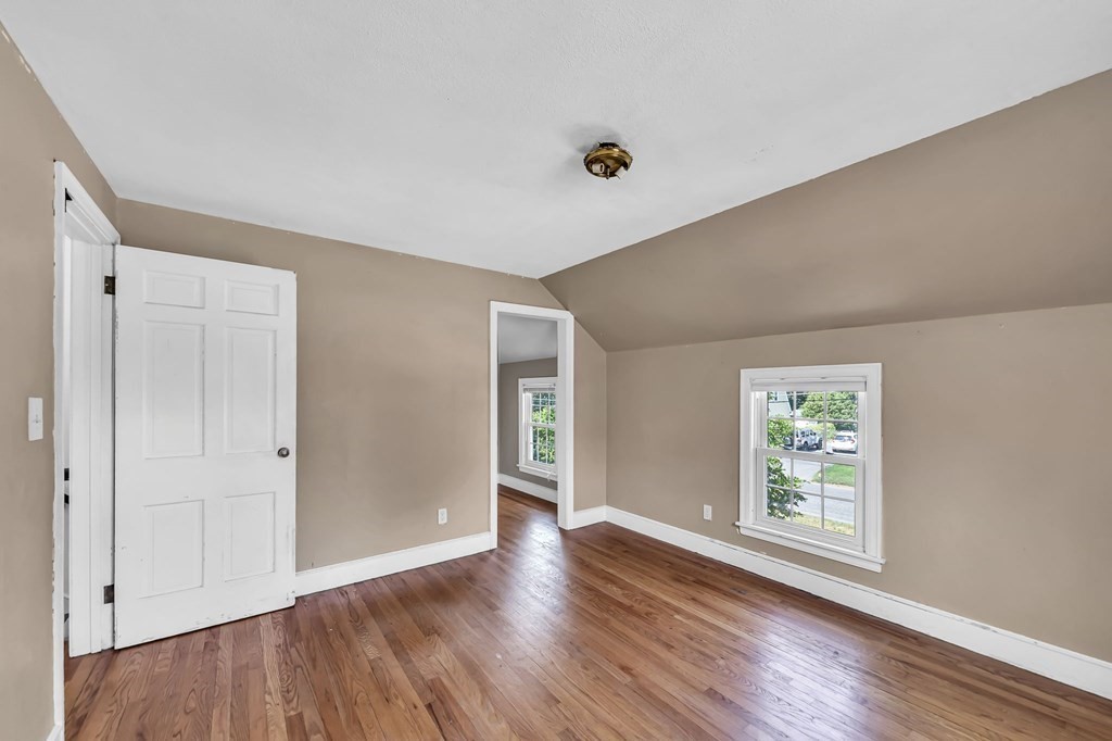41 Cooley Drive Longmeadow, MA 01106 - Photo 25 of 30 an empty room with wooden floor and windows