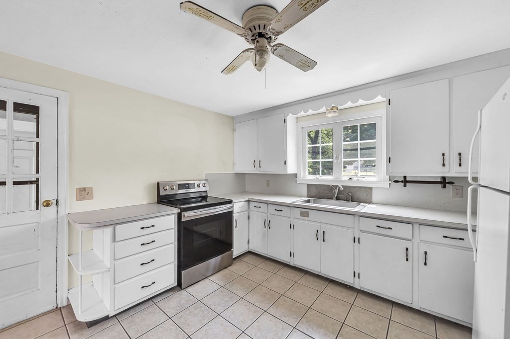 41 Cooley Drive Longmeadow, MA 01106 - Photo 9 of 30 a kitchen with white cabinets and sink