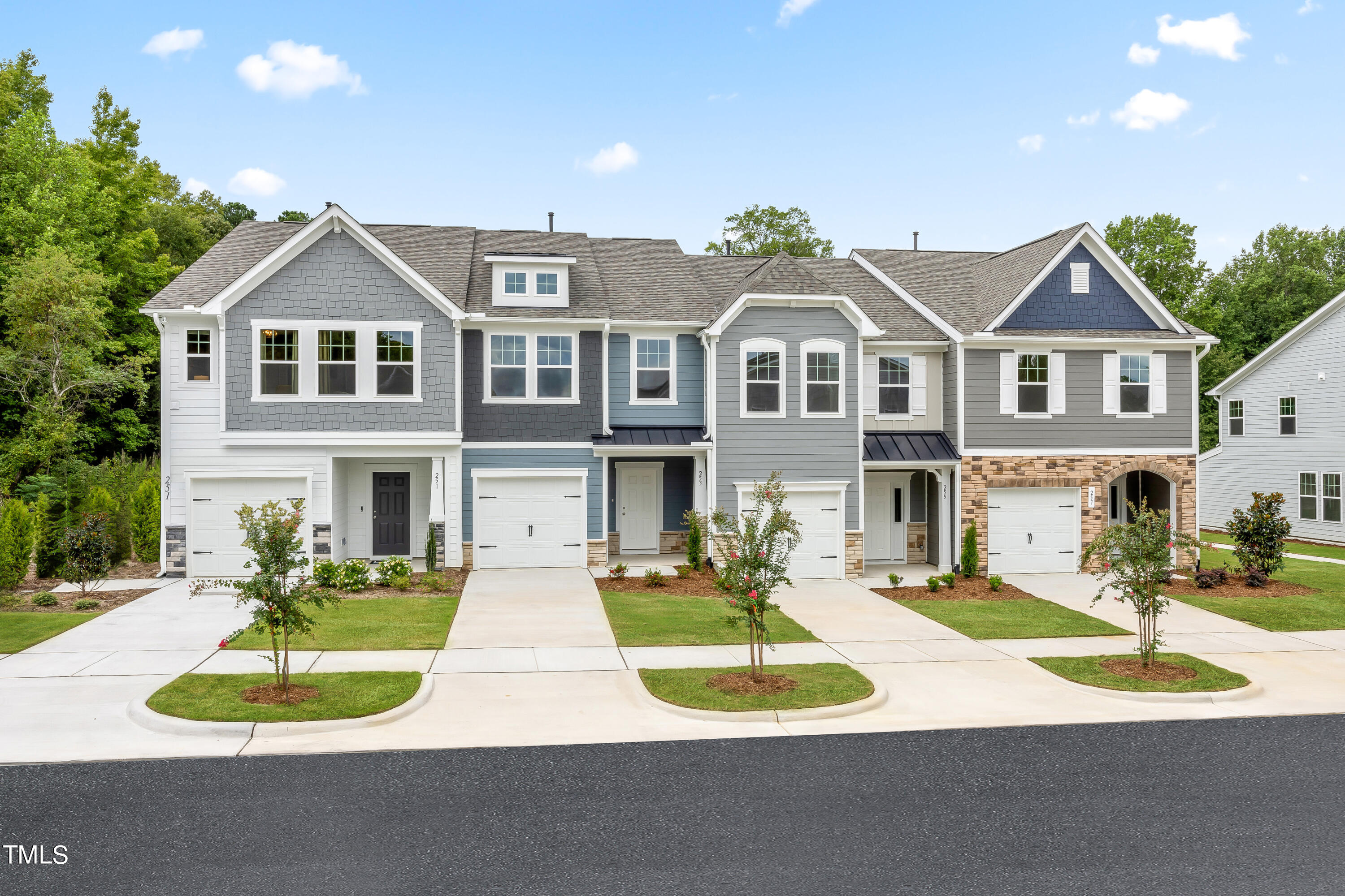 4973 Caddis Bend Raleigh, NC 27604 - Photo 22 of 29 a front view of a house with a yard and garage