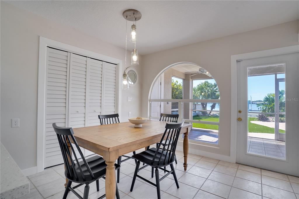 333 12th Avenue Indian Rocks Beach, FL 33785 - Photo 16 of 64 a view of a dining room with furniture and a window