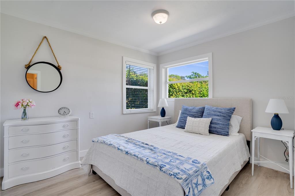 333 12th Avenue Indian Rocks Beach, FL 33785 - Photo 22 of 64 a bedroom with a bed and a cabinets