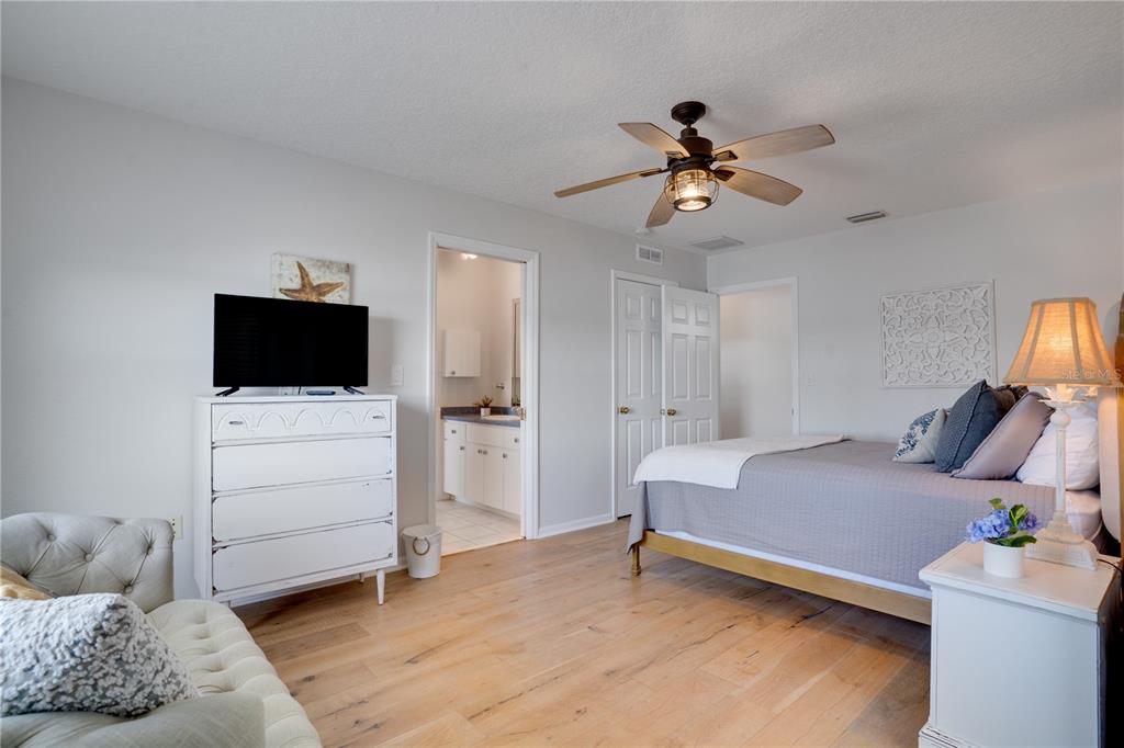 333 12th Avenue Indian Rocks Beach, FL 33785 - Photo 36 of 64 a bedroom with a bed and a flat screen tv