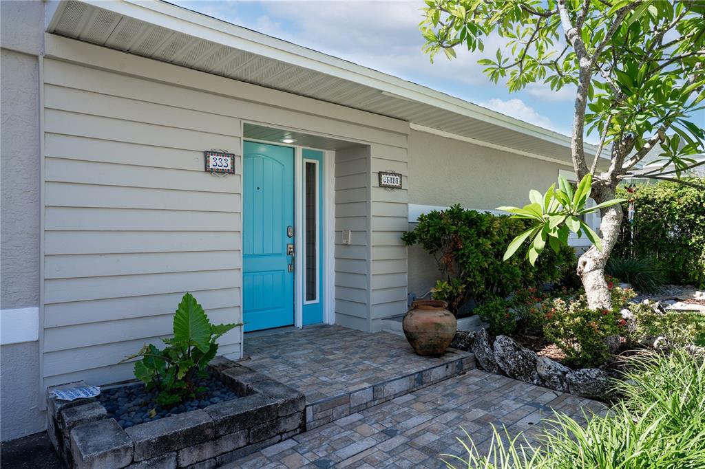 333 12th Avenue Indian Rocks Beach, FL 33785 - Photo 4 of 64 a view of a potted plants in front of a door