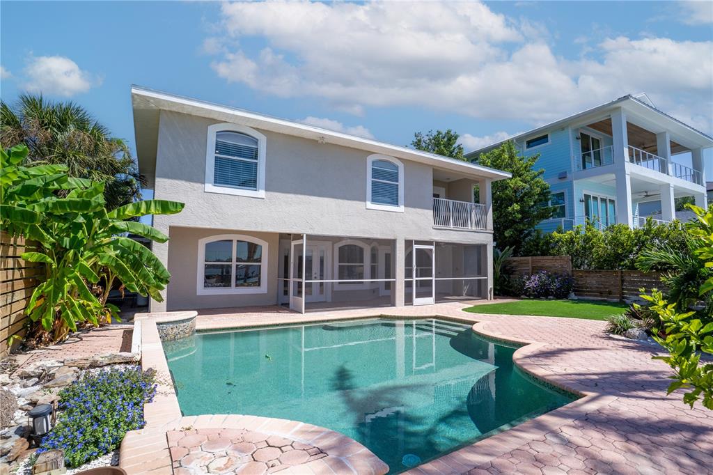 333 12th Avenue Indian Rocks Beach, FL 33785 - Photo 50 of 64 a front view of a house with a garden and plants