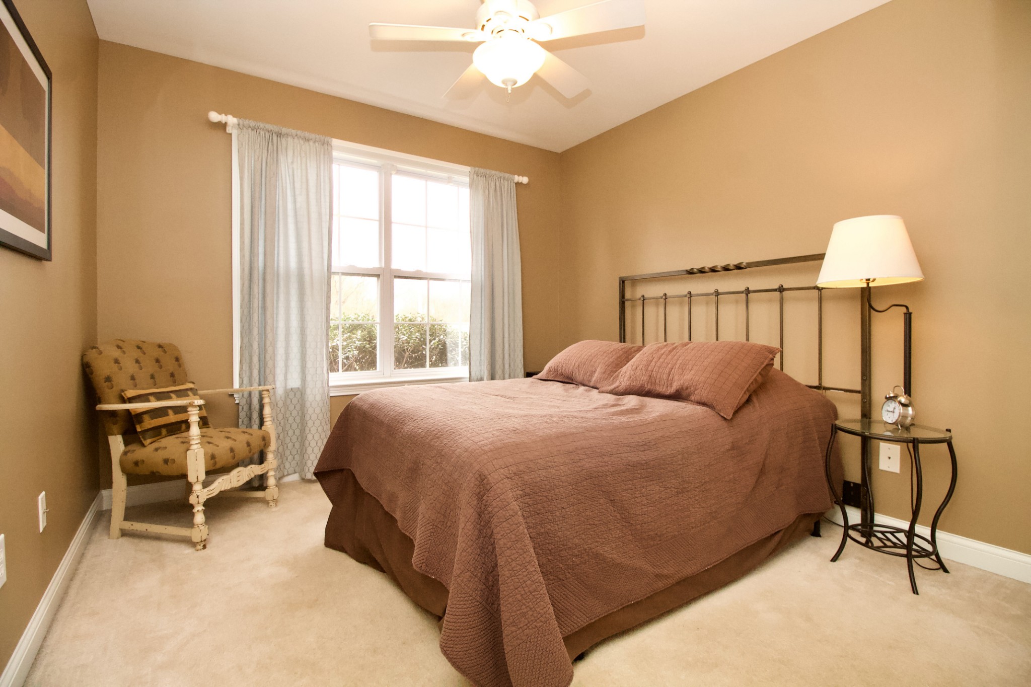 476 Jim Courtney Road Portland, TN 37148 - Photo 14 of 18 a bed room with a bed and a chair