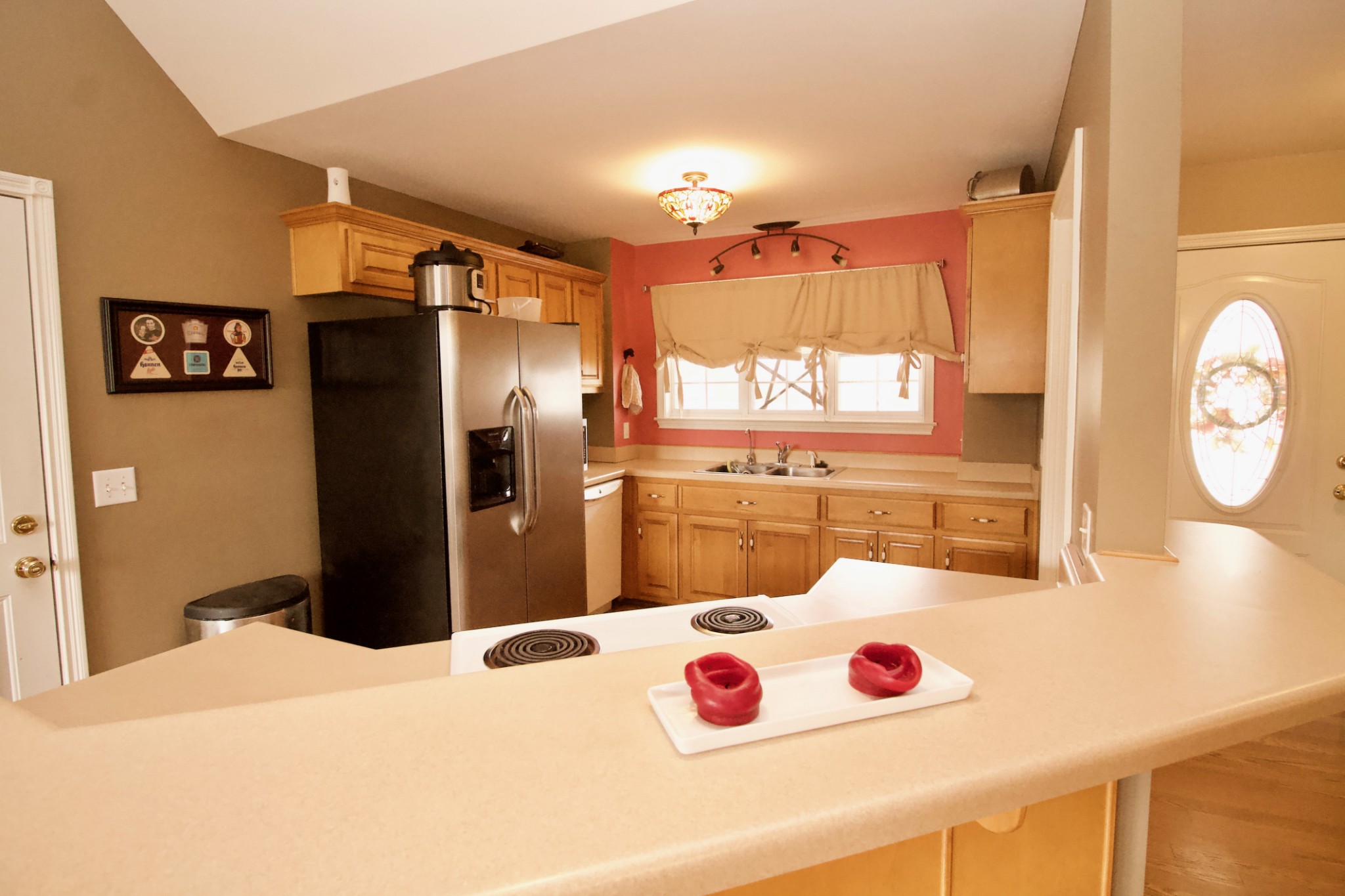 476 Jim Courtney Road Portland, TN 37148 - Photo 6 of 18 a kitchen with stainless steel appliances kitchen island granite countertop a refrigerator a sink and a stove