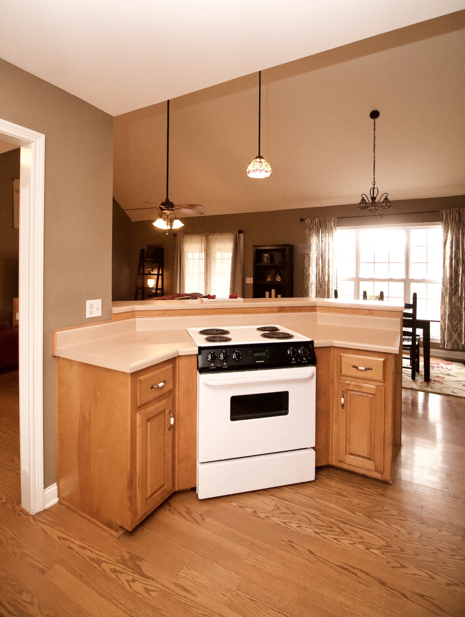 476 Jim Courtney Road Portland, TN 37148 - Photo 7 of 18 a kitchen with stainless steel appliances granite countertop a sink a stove and a wooden floors