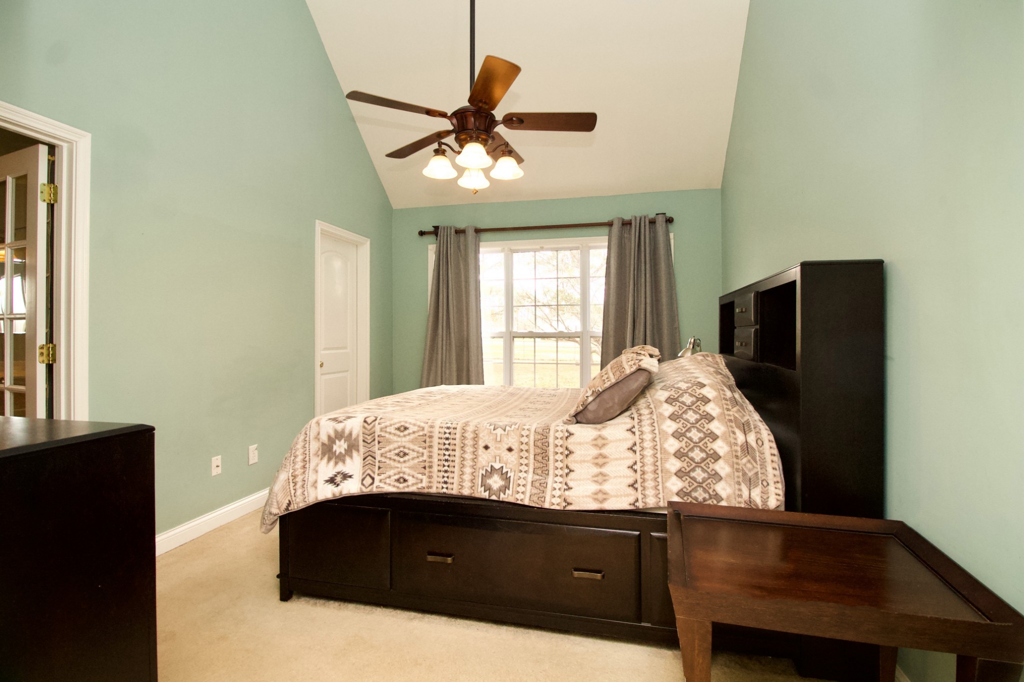476 Jim Courtney Road Portland, TN 37148 - Photo 10 of 18 a bed sitting in a bedroom next to a window