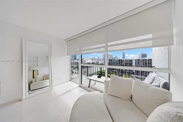 a living room with furniture and a large window