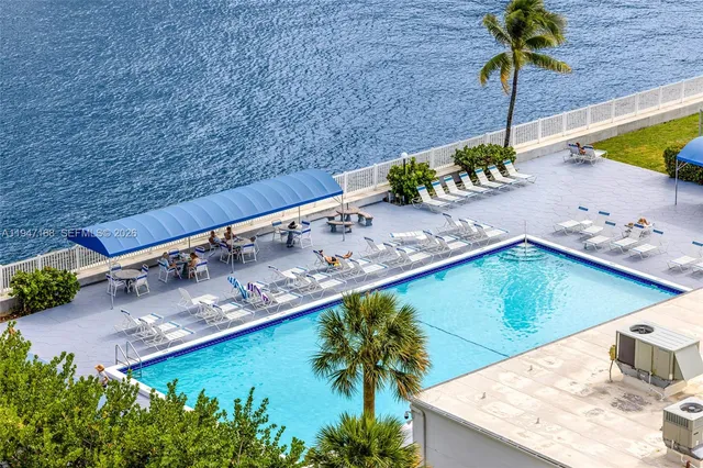 a living room with lots of furniture and a view of chandelier