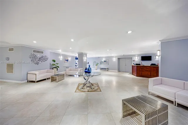 a view of a patio with a table and chairs under an umbrella