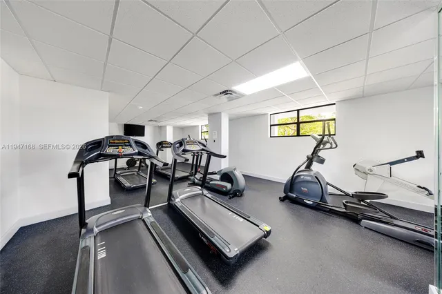 a view of a street with cars on the road