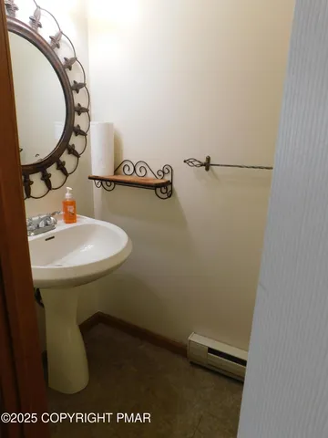 a bath tub sitting next to a white sink