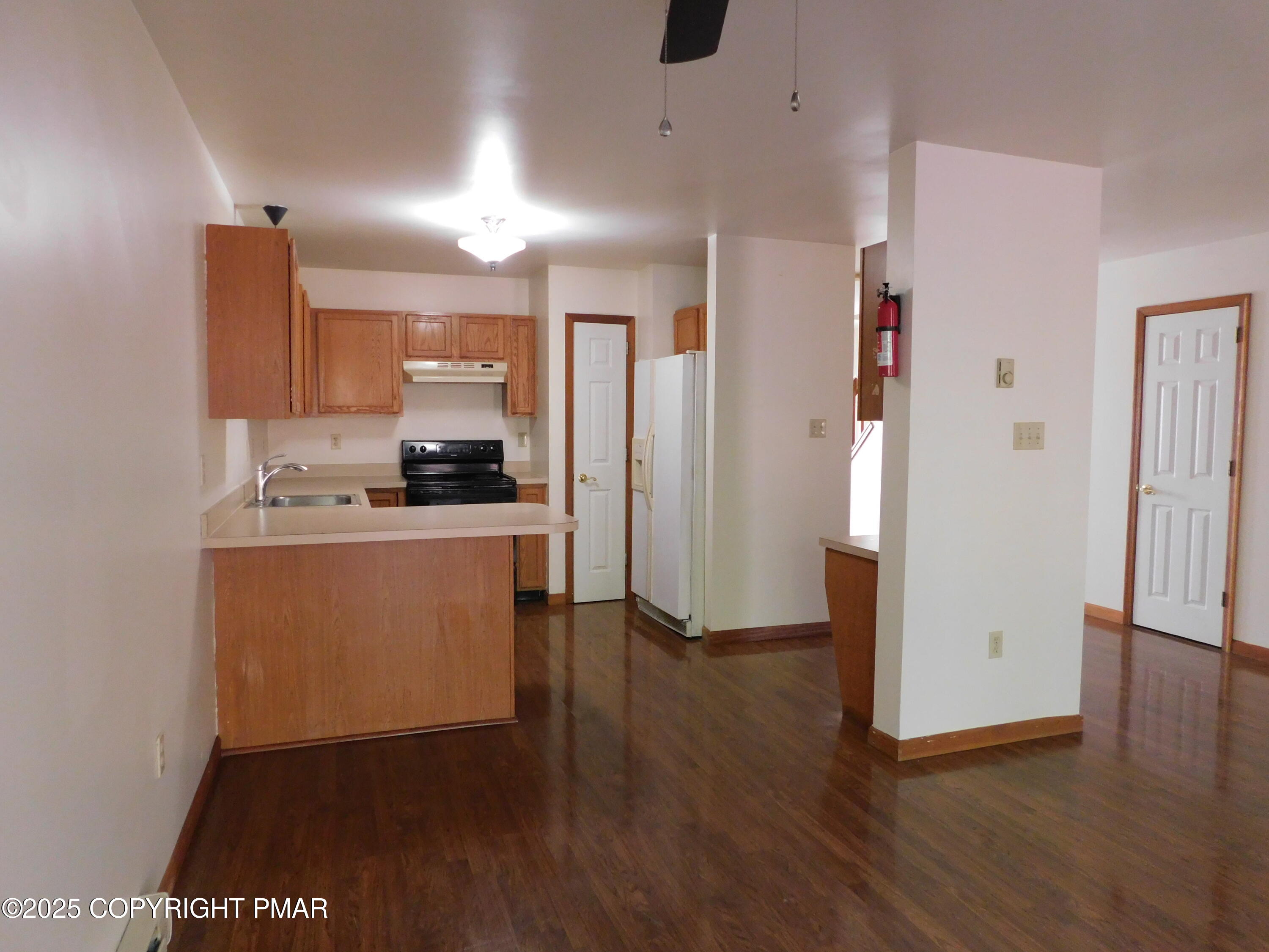 613 Country Acres Court Effort, PA 18330 - Photo 18 of 18 a kitchen with a refrigerator and a stove top oven