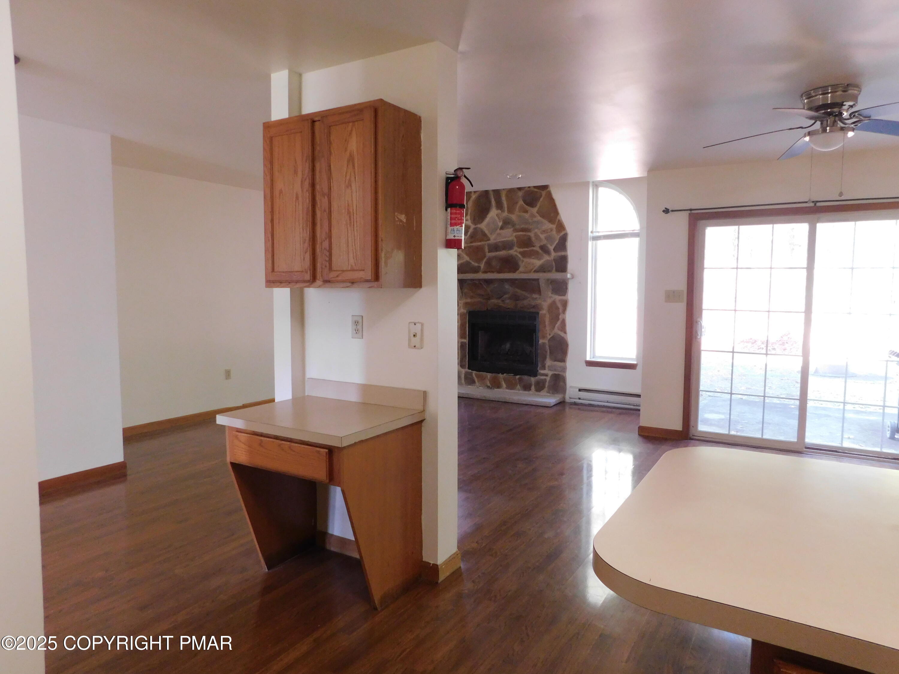 613 Country Acres Court Effort, PA 18330 - Photo 16 of 18 a living room with furniture and a fireplace