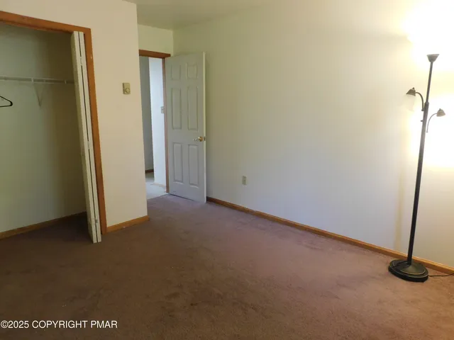 a view of a room with rack and window