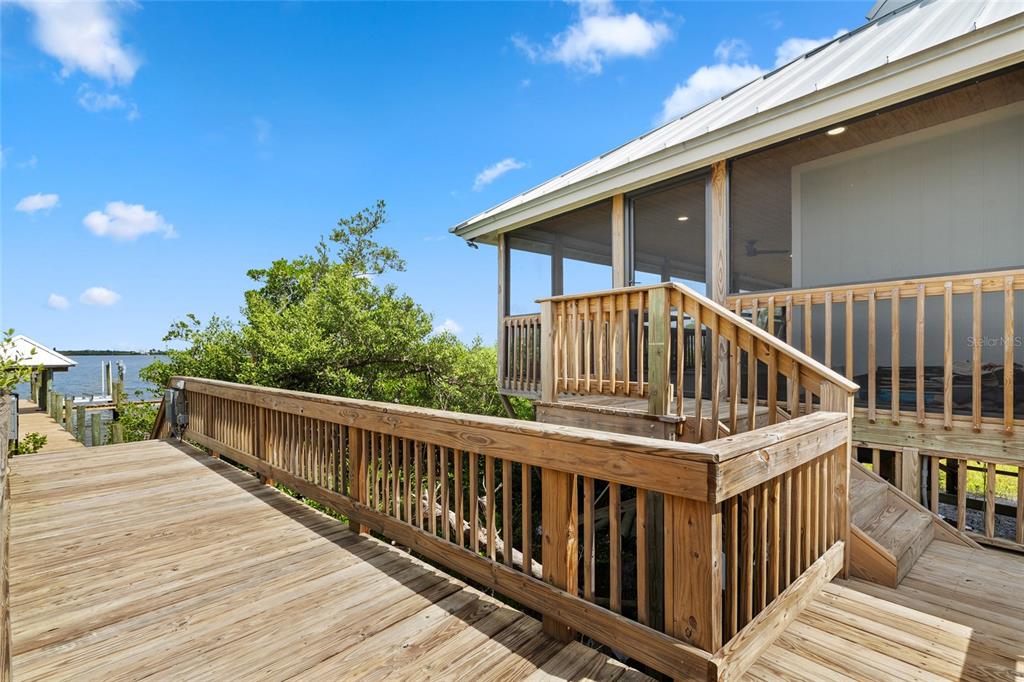 8772 Little Gasparilla Placida, FL 33946 - Photo 13 of 54 a view of balcony with deck and wooden floor