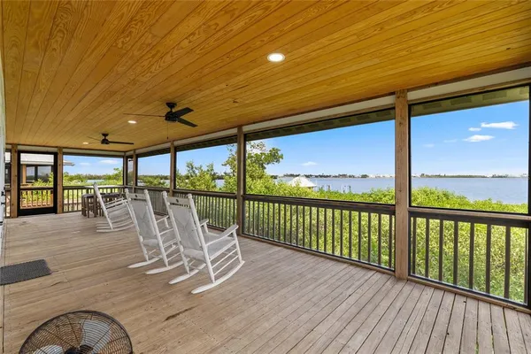 a view of a balcony with wooden floor
