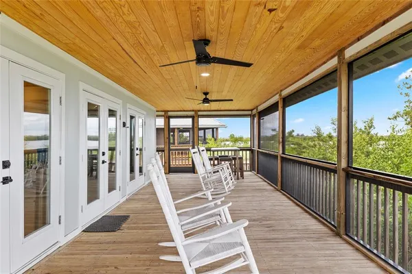 a view of a balcony with wooden floor