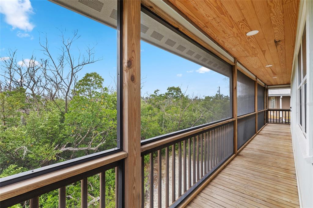 8772 Little Gasparilla Placida, FL 33946 - Photo 20 of 54 a view of a balcony with wooden floor