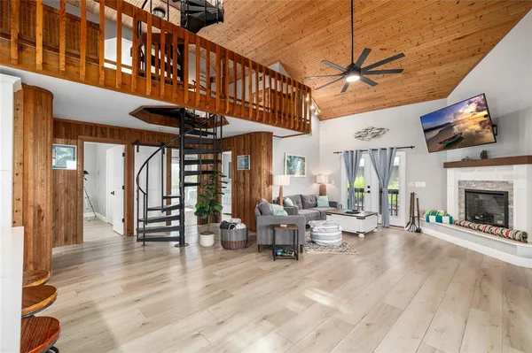 a kitchen with stainless steel appliances granite countertop white cabinets and a stove top oven