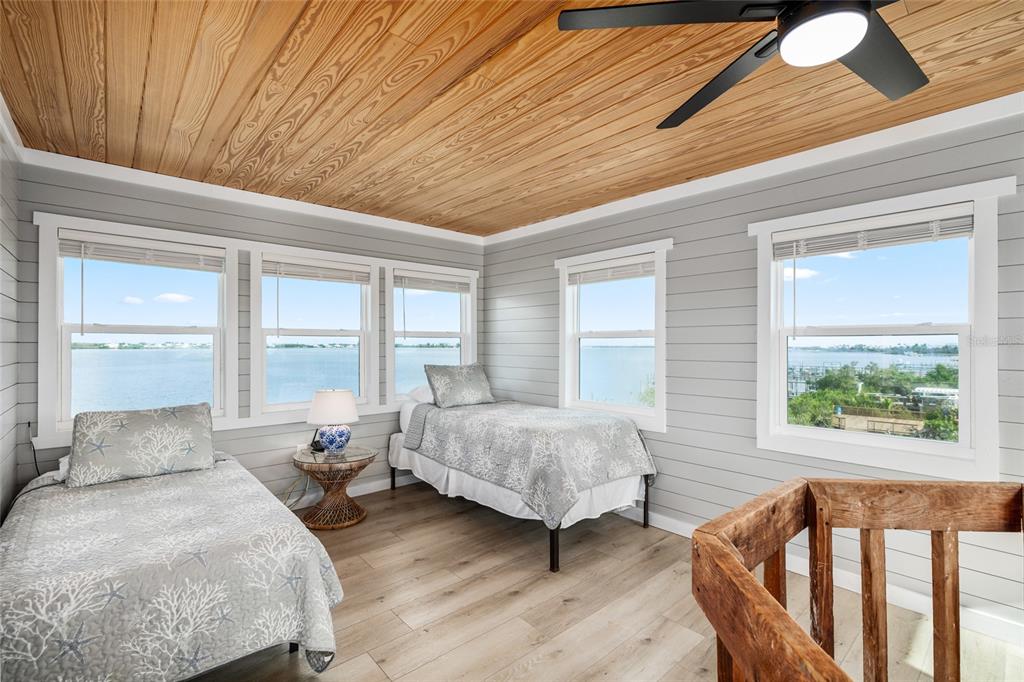 8772 Little Gasparilla Placida, FL 33946 - Photo 41 of 54 a spacious bedroom with a bed and a window