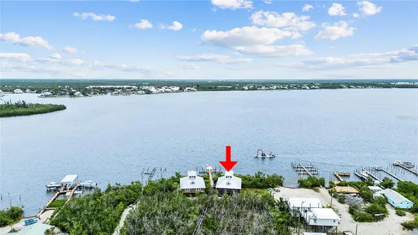 an aerial view of a houses with city view