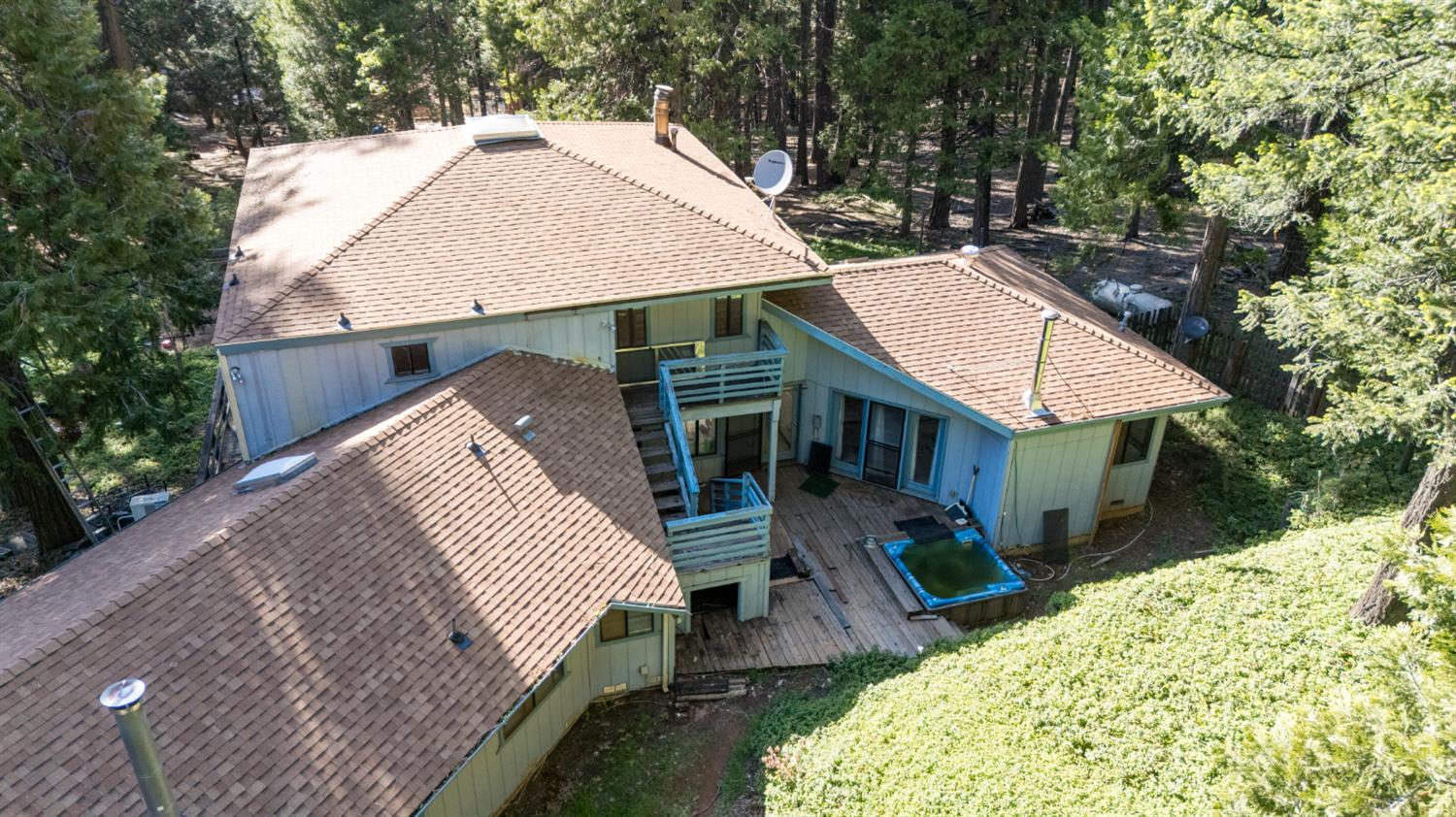 2070 King Of The Mountain Road Pollock Pines, CA 95726 - Photo 42 of 53 an aerial view of a house with a yard patio and fire pit