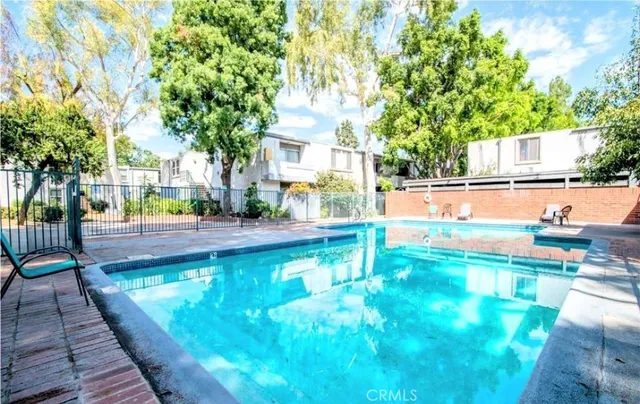 a view of yard with swimming pool and sitting area