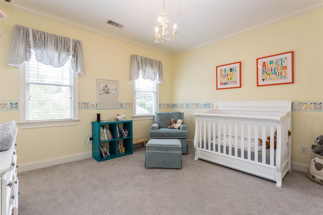 1716 Stannard Trail Raleigh, NC 27612 - Photo 17 of 30 Bedroom #2 enjoys direct access to a "Jack and Jill" style bath and features plantation blinds, crown molding, whimsical light fixture and a double door closet Bedroom #2