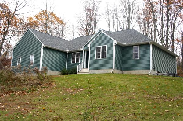 8 Collins Road North Brookfield, MA 01535 - Photo 1 of 27 a backyard of a house