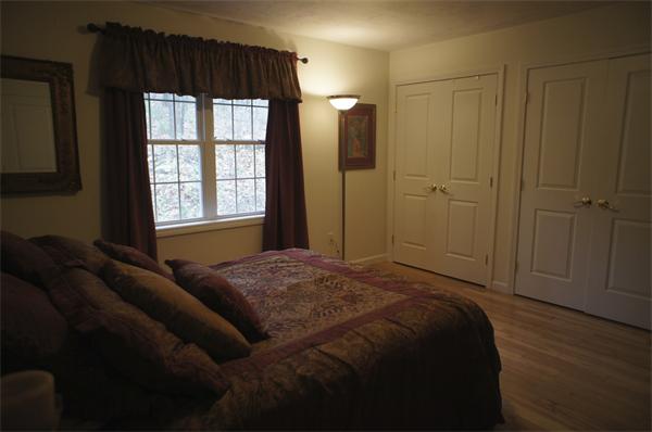 8 Collins Road North Brookfield, MA 01535 - Photo 11 of 27 a bed sitting in a bedroom next to a window