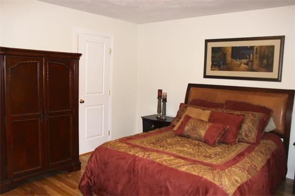 8 Collins Road North Brookfield, MA 01535 - Photo 12 of 27 a bedroom with a bed and wooden floor