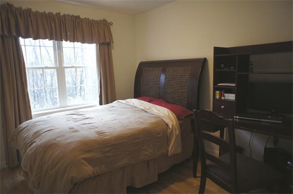 8 Collins Road North Brookfield, MA 01535 - Photo 14 of 27 a bed sitting in a bedroom next to a window