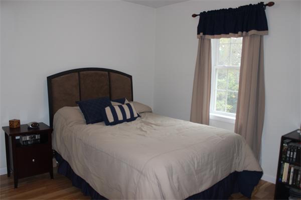 8 Collins Road North Brookfield, MA 01535 - Photo 19 of 27 a bedroom with a bed and a mirror