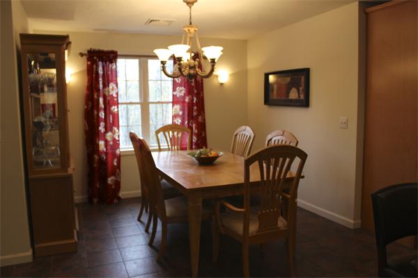 8 Collins Road North Brookfield, MA 01535 - Photo 5 of 27 a view of a dining room with furniture and chandelier