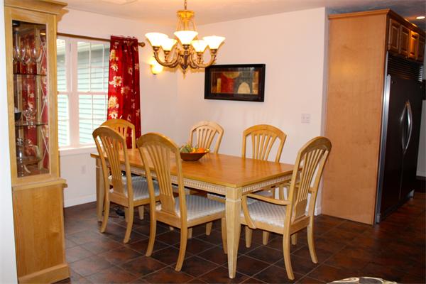 8 Collins Road North Brookfield, MA 01535 - Photo 7 of 27 a dining room with furniture a chandelier and wooden floor