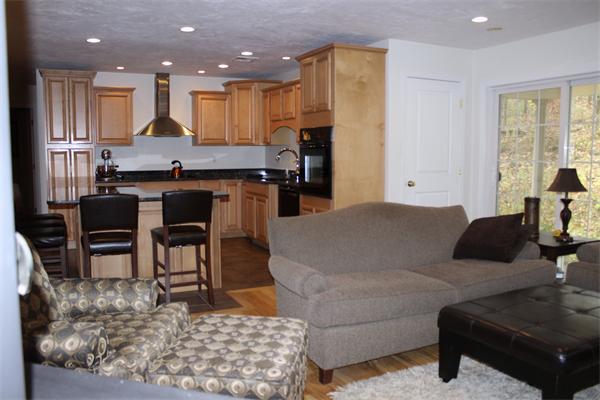 8 Collins Road North Brookfield, MA 01535 - Photo 9 of 27 a living room with stainless steel appliances kitchen island granite countertop furniture and a large window