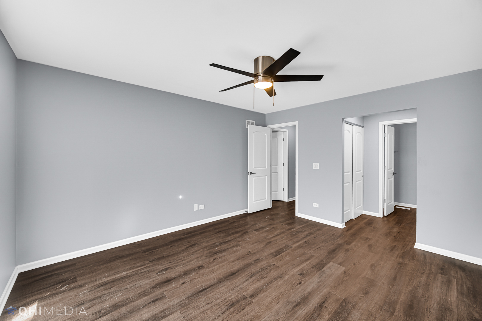157 Virginia Court Streamwood, IL 60107 - Photo 13 of 17 a view of empty room with wooden floor and fan